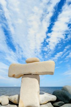 Stack of two long pebble on the sea coast