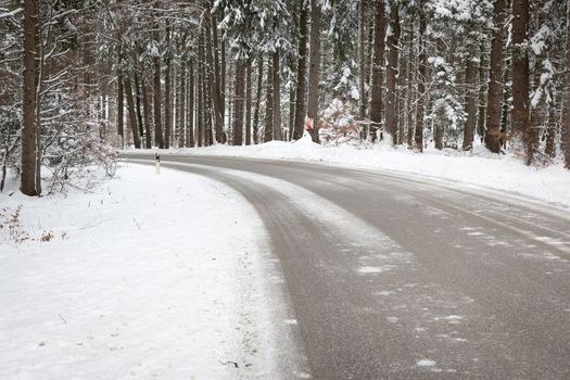 An image of a deep winter snowy road