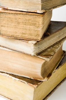 Pile of old books on white background