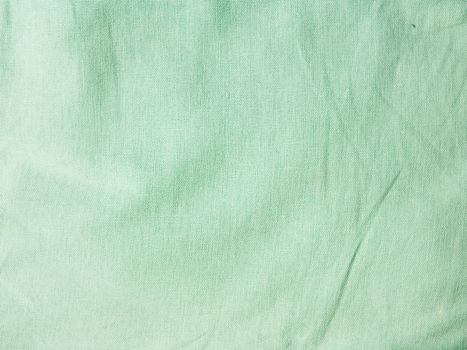 Green wrinkled fabric texture