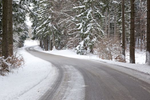 An image of a deep winter snowy road