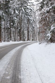 An image of a deep winter snowy road