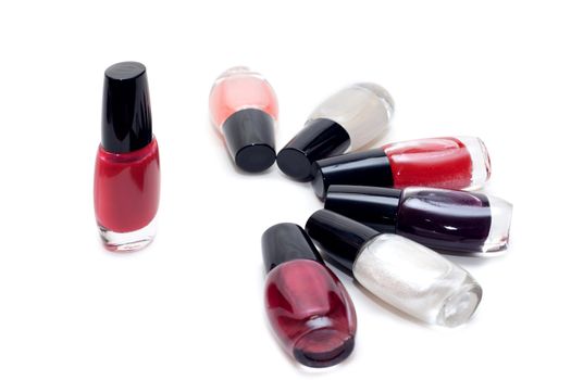 Vials colour varnish nailwaer, make-up insulated on white background