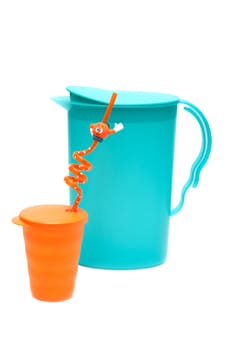 Plastic pitcher and glass on white background