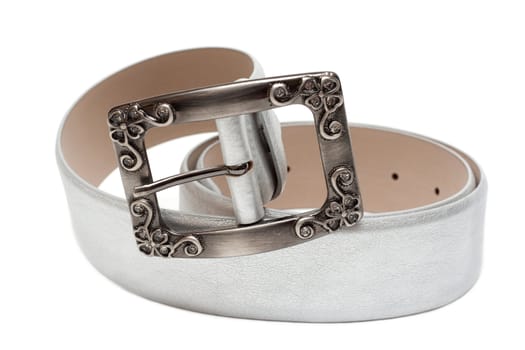 Leather silvery feminine belt, buckle with pattern