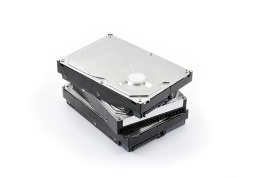 Three hard disks stacked on a white background