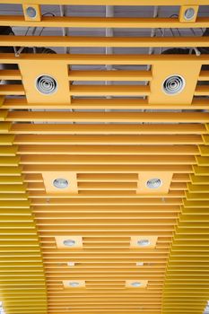 Abstract background of yellow ceiling of modern architecture.