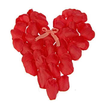 a big red heart - made of rose leaves - with a bow