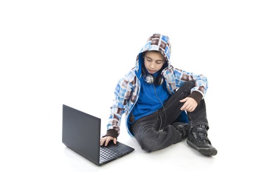 a boy with a laptop on a white background