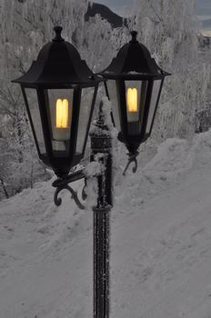 two outdoor lights in the winter