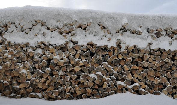 a wooden stable in the winter