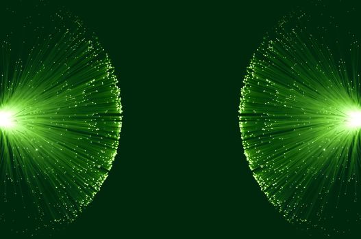 Two groups of illuminated green fibre optic light strands eminating from the left and right image border against a green background