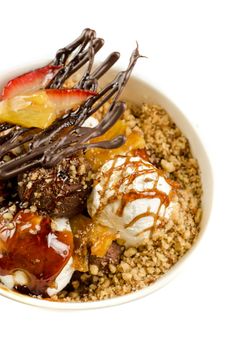 ice cream with chocolate, nuts and caramel close up
