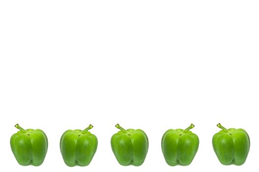 Five small whole green peppers arranged horizontally along the bottom border of the image over white.