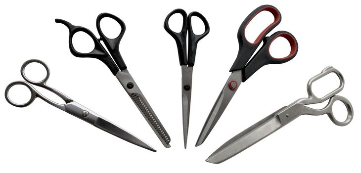 set of of scissors for hair cutting, tailor and clerical work