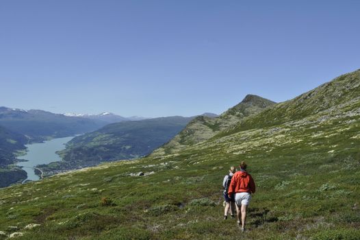 a group of people hiking in the mountains