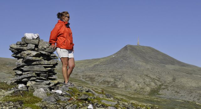 a woman in a norwegian mountain landscape