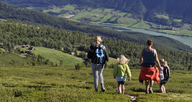 a group of people hiking in the mountains