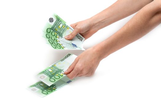 Hands of the girl considers euro on white background