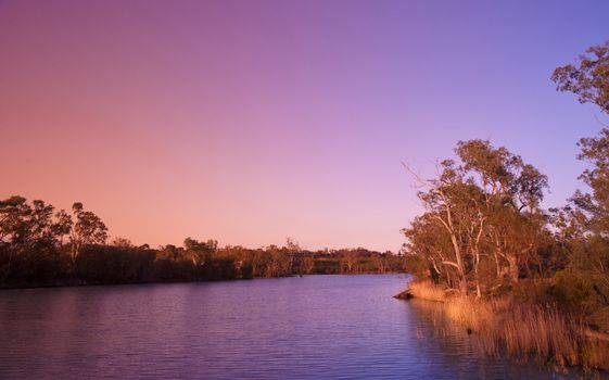 sunset on the water of the river murray south australia