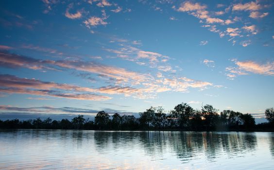 sunset on the water of the river murray south australia