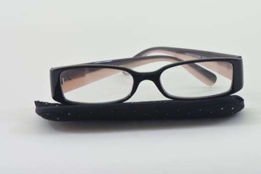 reading glasses on table whit background