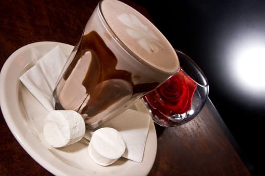 Hot Chocolate with marshmellows and a rose. 