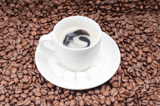 Shot of slabs of shugar and cup of coffee