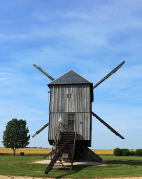 Back part of a traditional wooden windmill in France in the Eure &Loir Valley region.This is "The big windmill from Ouarville".
