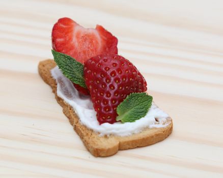 Tasty snack toast sandwich on a wooden surface.