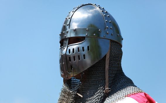 Image of a templar knight helmet against a blue sky.Natural lighting.