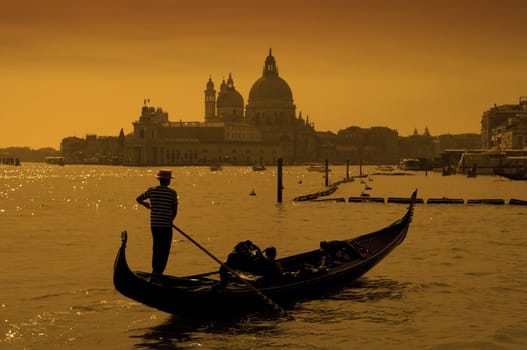 Gondolier at the dusk in Venice, Italy