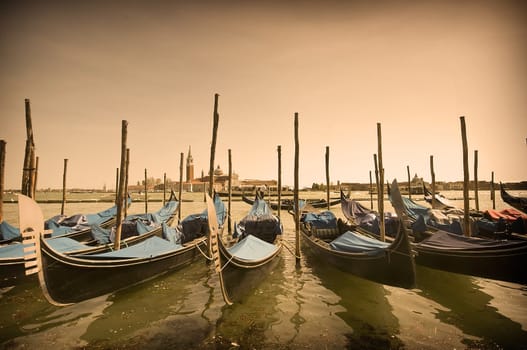 Many parked gondolas at the dusk in Venice, Italy