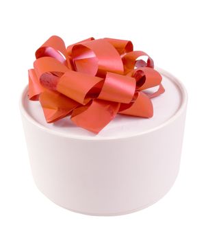 Round white gift box with a red bow