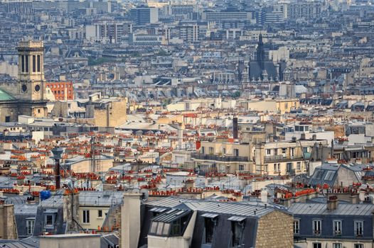 Aerial panorama above houses rooftops in a Paris