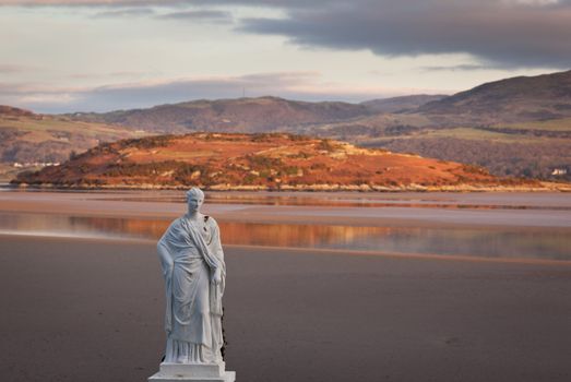 View across the estuary on the North coast of Wales in winter from Portmeirion village with statue