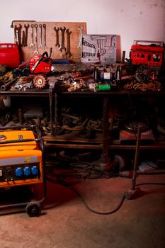 Detail view of the inside of a garage with many tools.