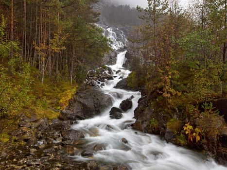 Langfossen in Etne, running right next to the road