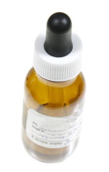 A dropper bottle containing naturopathic medicine, isolated on a white background.
