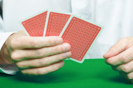 cards in the hands of gamblers. Card Game
