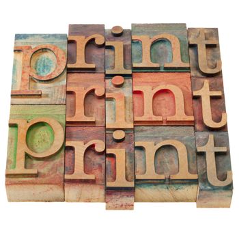 print word abstract in vintage wooden letterpress printing blocks, stained by color inks, isolated on white