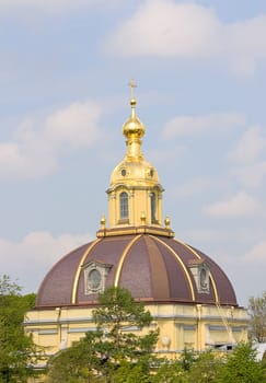 View of dome of  church  among trees, Saint Petersburg, Russia.