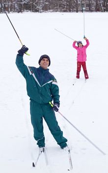 father and daughter have fun at cross country skiing