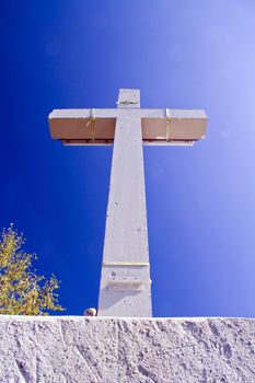 cross symbol on mountain summit