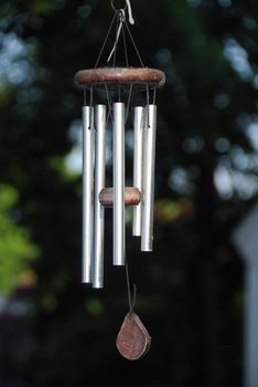 A Wind chime isolated against a natural background