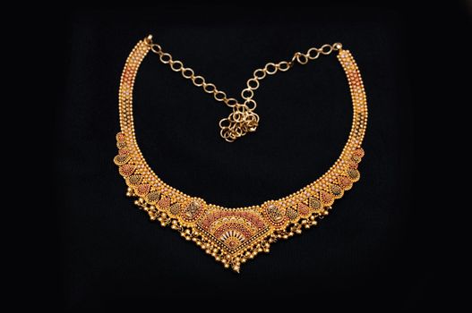 an authentic indian jewellery isolated on black background