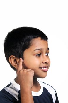 an handsome young indian kid thinking about something