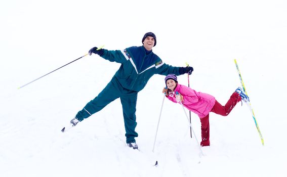 father and daughter have fun at cross country skiing