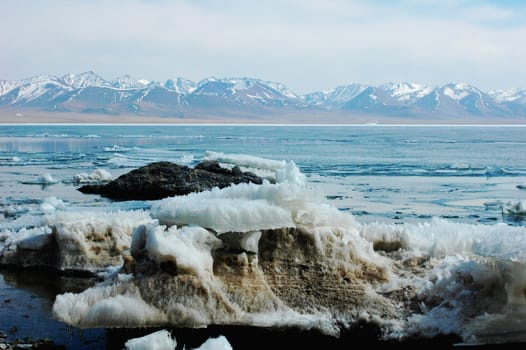 Scenery of a frozen lake and mountains in Tibet