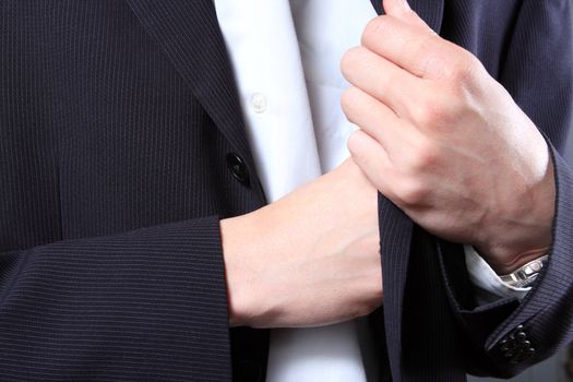 businessman hand in  pocket of a jacket 